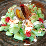 Gnocchetti verdi con salmone calamari e mandorle di mare