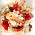 Speghetti di seppia con panzanella di scampi, cardoncelli e pomodorini confit